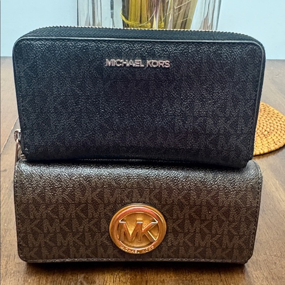 Michael Kors Other - Boundle of 2 Michael Kors Brown and Black Signature Wallets with in EUC.